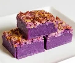 Delicious butter mochi dessert topped with vibrant ube for added flavor.