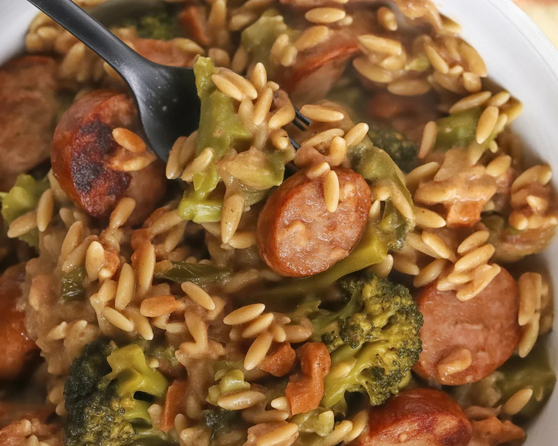 Delicious Chicken Sausage and Broccoli Orzo Skillet in a cast iron pan