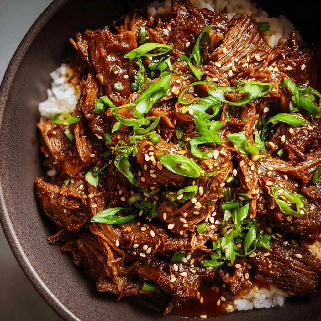 Delicious slow cooker Korean beef served in a bowl with rice and vegetables.