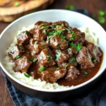 Tender slow cooker beef tips served with rich gravy and vegetables.