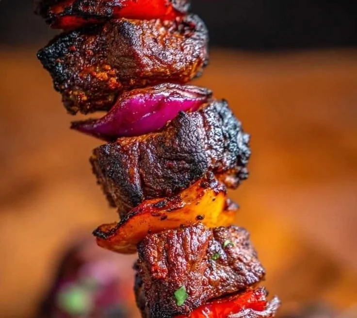 Delicious beef kebab skewers ready to serve with fresh vegetables