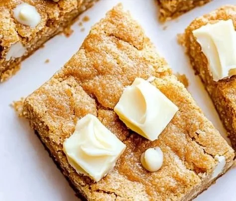 Delicious Christmas Biscoff white chocolate chip bars on a festive plate.