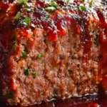 Savory smoked meatloaf glazed with sweet sauce, ready to serve for family dinners.