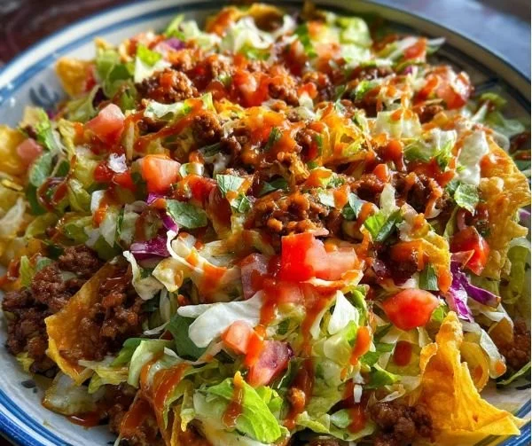 Taco Salad with Catalina Dressing garnished with fresh ingredients served in a bowl